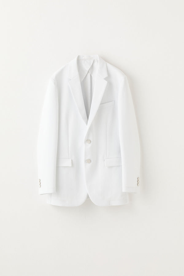 White suit jacket on a light gray background